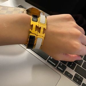 Hermes clic H bracelet black and yellow gold
